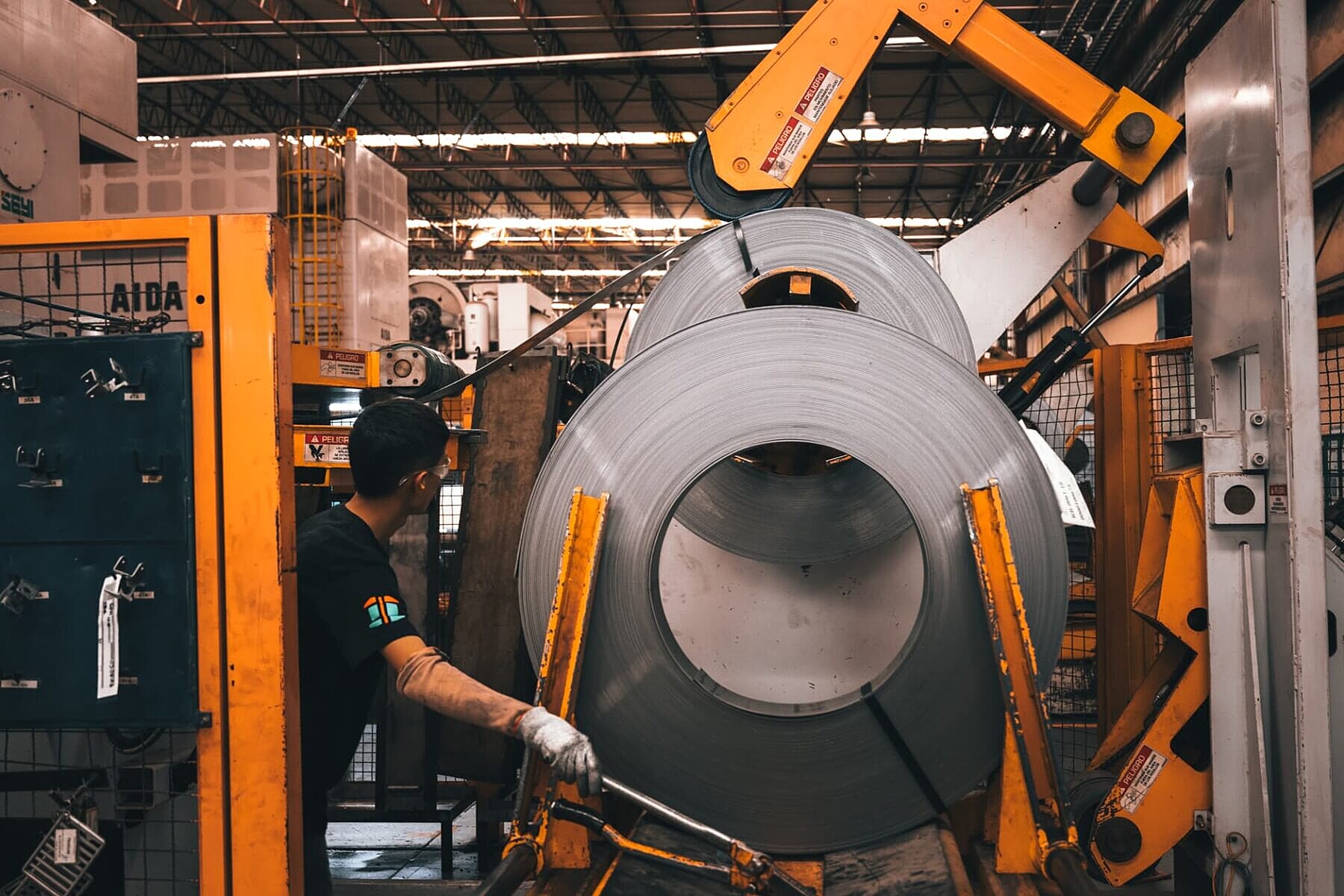 Steel coil being loaded into the press feed line