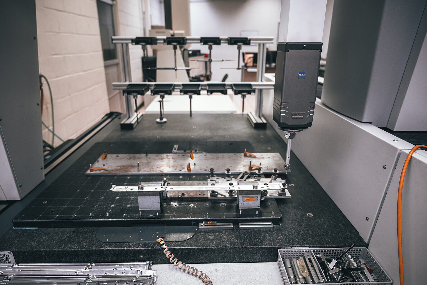 Zeiss VAST scanning probe measuring a stamped rail on a granite table