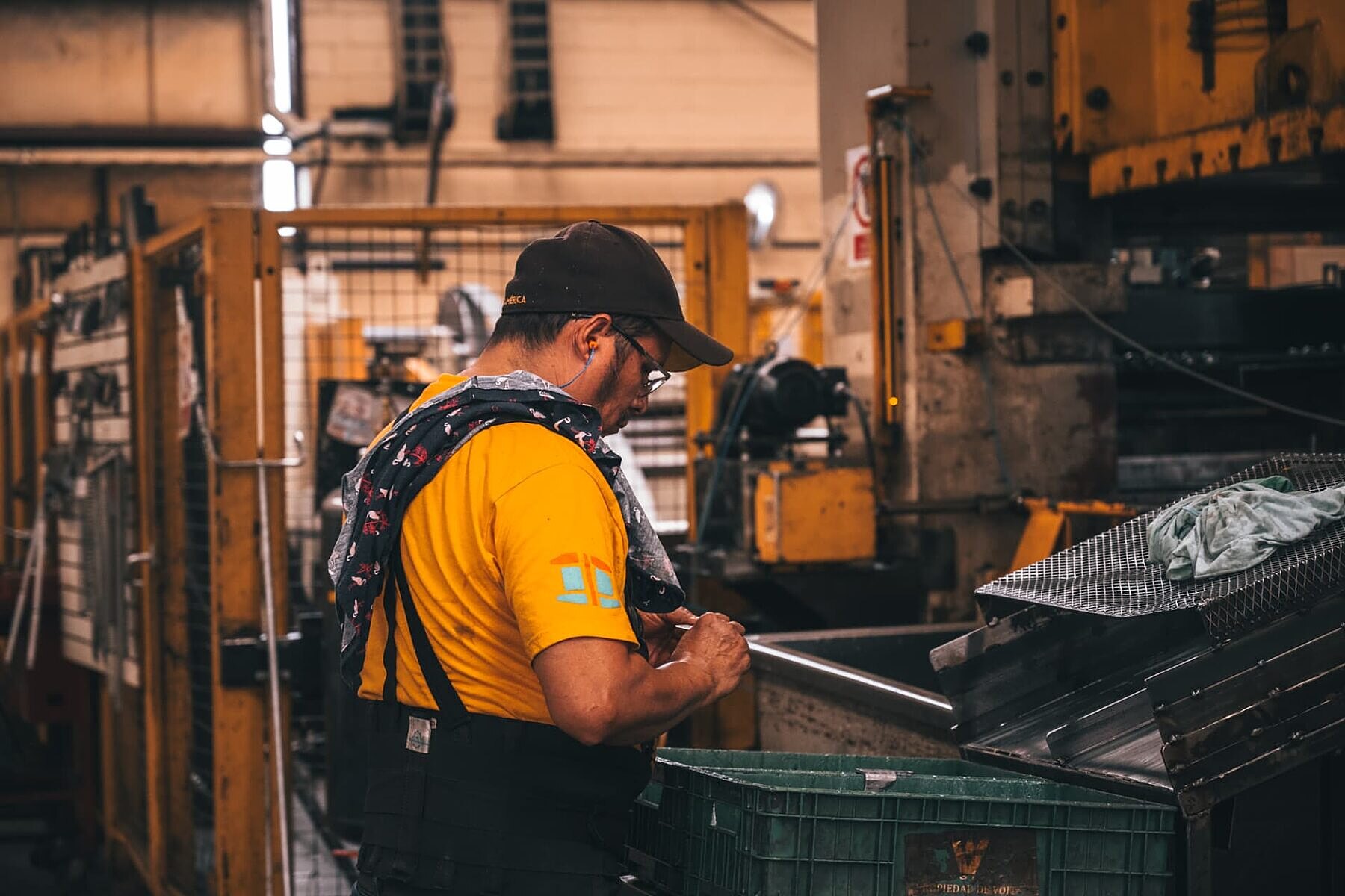 Operator sorting finished stamped parts on the shop floor